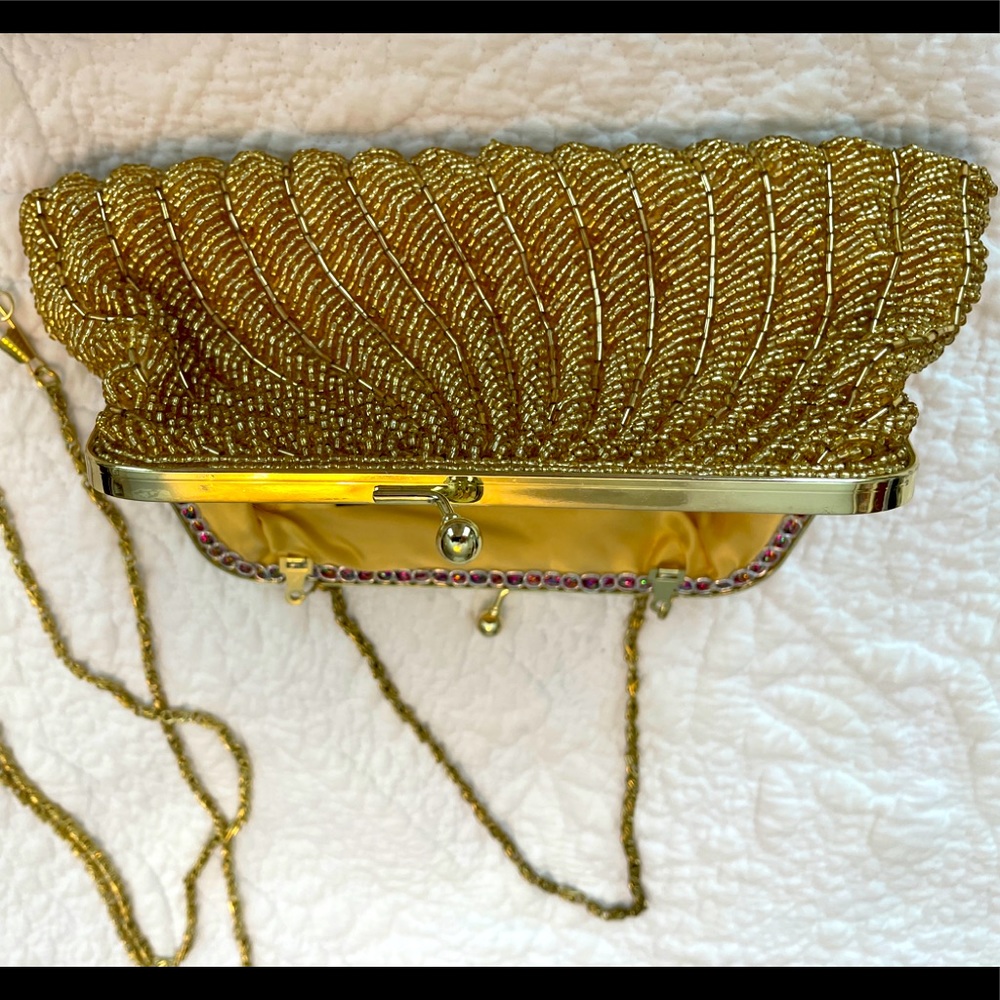 Intricate gold beaded purse.